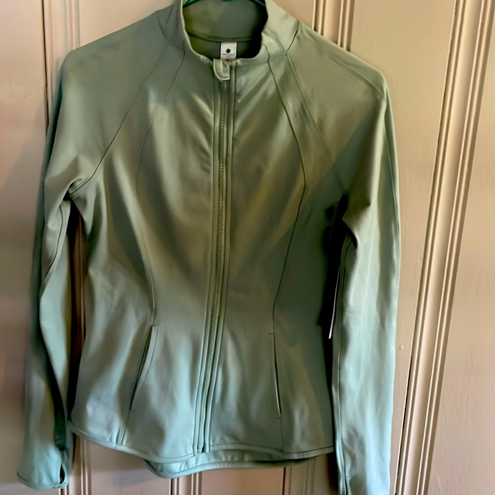 New with tags. Yogalicious Lux Full Zip Jacket.  Size small. Sage green.